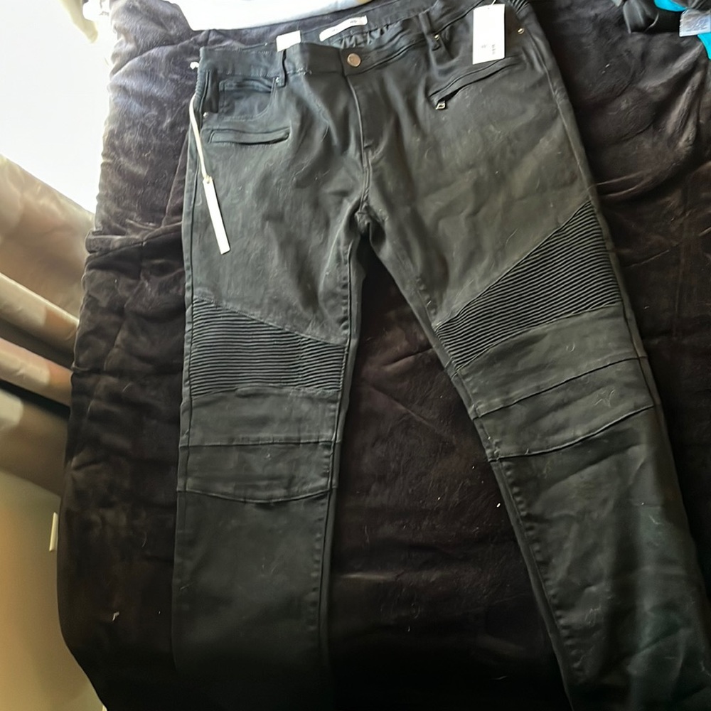 Embellish Black jeans with textured leg styling.